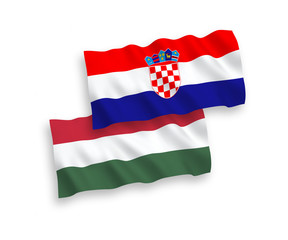 National vector fabric wave flags of Croatia and Hungary isolated on white background. 1 to 2 proportion.