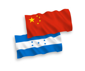 National vector fabric wave flags of Honduras and China isolated on white background 1 to 2 proportion.