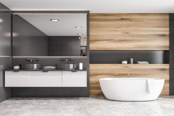Fototapeta na wymiar Gray tile and wooden bathroom, tub and sink