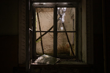 Abandoned window frame from inside old building