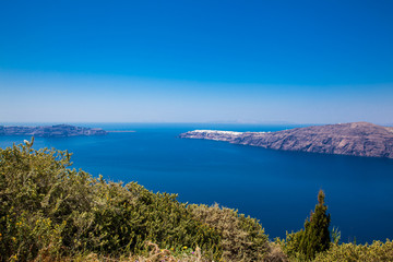 Fototapeta na wymiar The beautiful Aegean Sea seen from the walking trail number 9 which connects the cities of Fira and Oia on the Santorini Island