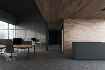 Dark gray open space office with reception
