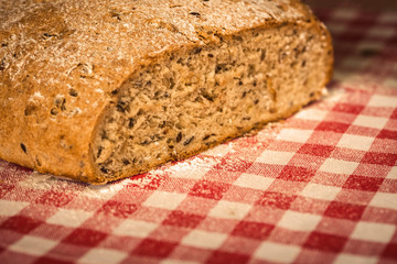 fresh baked bread. fresh homemade sliced bread on a red napkin.