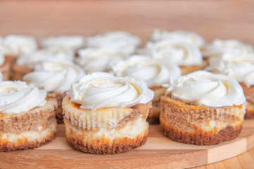 small rounded cakes with pumpkins and white meringue