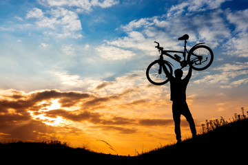 Sunset in the mountains with mountain biking winner delight.