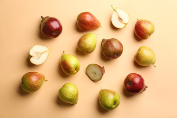 Ripe juicy pears on beige background, flat lay