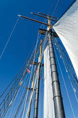 Obraz premium Skyward view of Tall Ship masts and sails