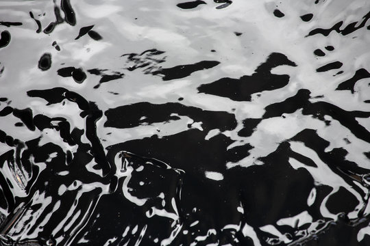 Liquid bitumen surface, abstract background