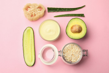 Flat lay composition with handmade face mask and ingredients on pink background
