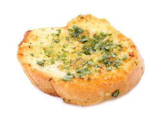 Slice of bread with garlic, cheese and herbs on white background