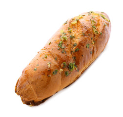 Bread loaf with garlic and herbs on white background