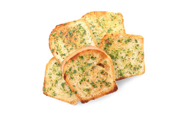 Slices of bread with garlic and herbs on white background, top view