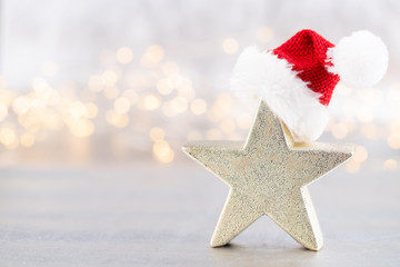 Christmas star, decor on bokeh silver background. Christmas or New Year minimal concept.