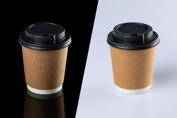 Cardboard coffee cup with lids. Black and white background.