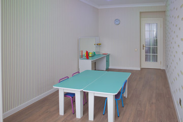 child development center room and desk . Kindergarten preschool classroom interior.