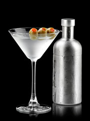 Cocktail with green olives and a shaker
