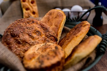 Breads in bowl with rustic blanket