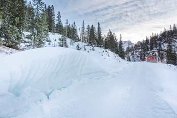 WInter landscape in the austrian mountains with snowdrifts on the roadside