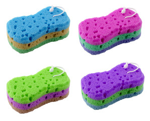 Set of sponges in different colors for washing dishes on a white background. The sponge has a knurled surface. It can be used for household and car wash.