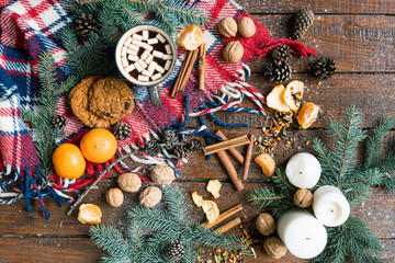 Christmas background with food, other objects and symbols on wooden table