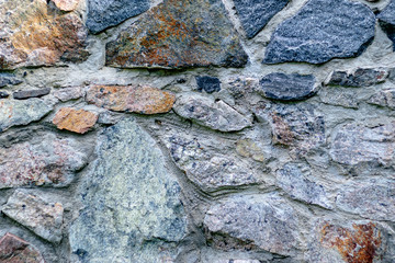 Fragment of a wall from a chipped stone for background