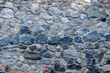 Fragment of a wall from a chipped stone for background