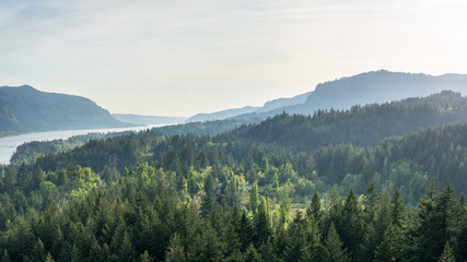 Setting sun highlights a spot of land by Columbia river