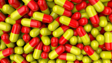 Colorful background pills. Red-yellow medical pills