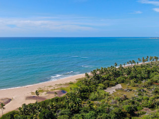 Aerial view of tropical beach and turquoise clear sea water