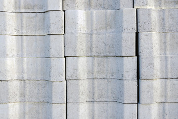 .gray road tile is folded into a block on a pallet for the reconstruction of the road, square, sidewalk. paving background