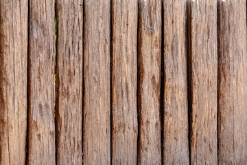 Wooden wall from logs of pine as a background texture