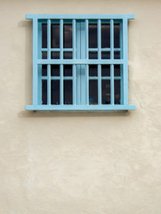 View of an old wooden window at sunset in the streets of the colonial town of Villa de Leyva, in the Andean mountains of central Colombia.