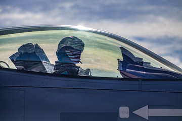 Fighter jet on the runway with pilot preparing for takeoff