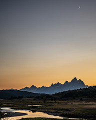 Grand Teton mountains behind the Buffalo River at sunset