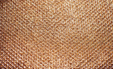 Gold thread on the fabric.