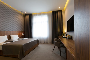 Hotel bedroom interior in the morning - obrazy, fototapety, plakaty
