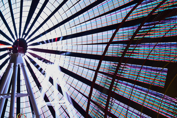 night lights and ferris wheel in amusement park