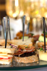 On the table are snacks and wine. Food for receptions. Catering