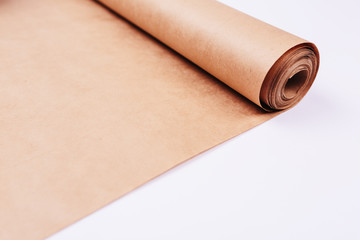 Twisted into roll brown wrapping paper white background