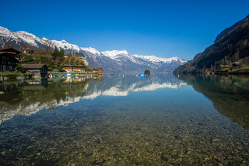 Fototapeta na wymiar The beautiful Lake Brienz from a stunning viewpoint at Iseltwald village that located om the shore at the middle of the lake. 