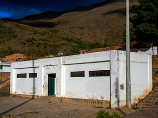 The public toilet building at the marketplace of the colonial town of Villa de Leyva, at sunset, in the Andean mountains of central Colombia.