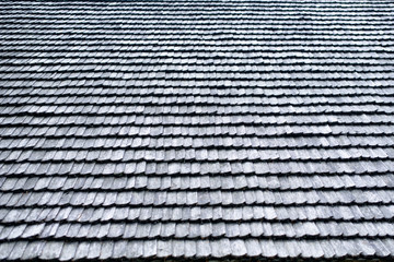 Old roof made of gray wooden planks. Backgrounds and textures