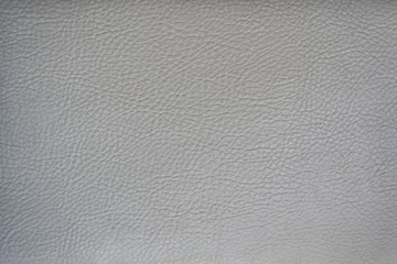 Light gray leather smooth surface. Backgrounds and textures
