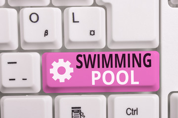 Writing note showing Swimming Pool. Business concept for Structure designed to hold water for leisure activities White pc keyboard with note paper above the white background