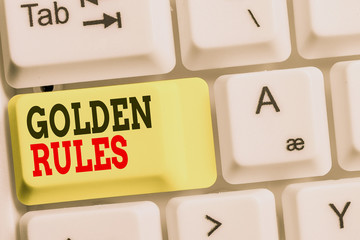 Handwriting text Golden Rules. Conceptual photo Basic principle that should be followed Important Principle White pc keyboard with empty note paper above white background key copy space