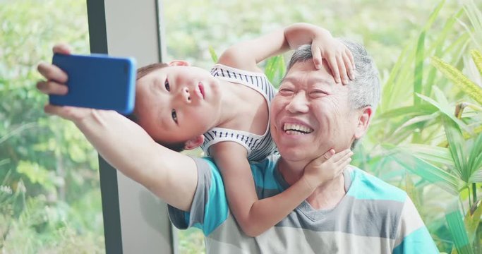 grandfather take selfie with grandson