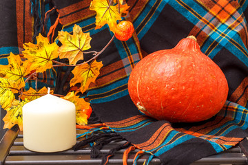Autunm composition with pumpkin, candles and leaves. Concept autumn comfort