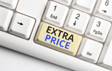 Text sign showing Extra Price. Business photo showcasing extra price definition beyond the ordinary large degree White pc keyboard with empty note paper above white background key copy space