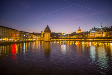A nice evening around the city center of Lucerne , in the center of the picture you can see the famous Chapel Bridge that made mainly from wood. 
