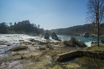 A beautiful day at the Rhine Falls in Switzerland , those amazing waterfalls considered as the widest in Europe for a good reason , its HUGE !
